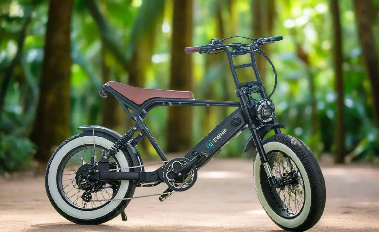 Stylish street-legal e-bike with white-walled tires, EN15194 certified, set in a lush forest path.