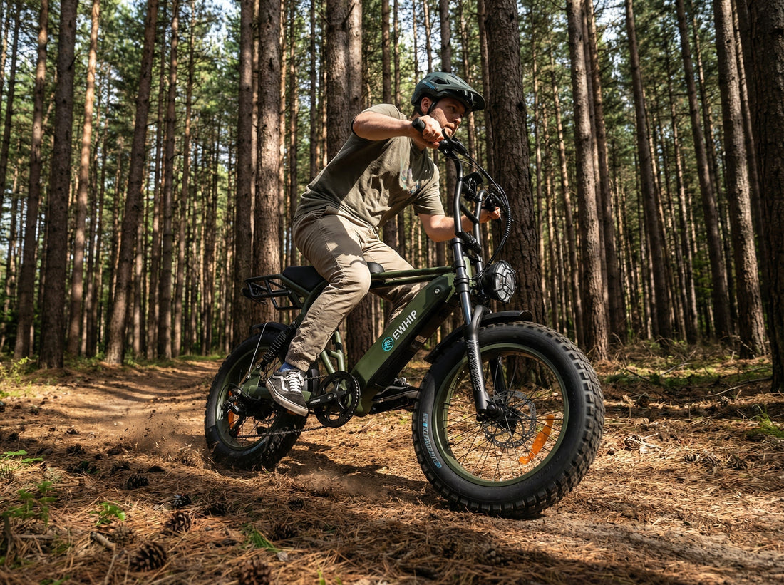 Riding a green fat-tire e-bike on a forest trail, perfect for off-road adventures and street-legal commuting.