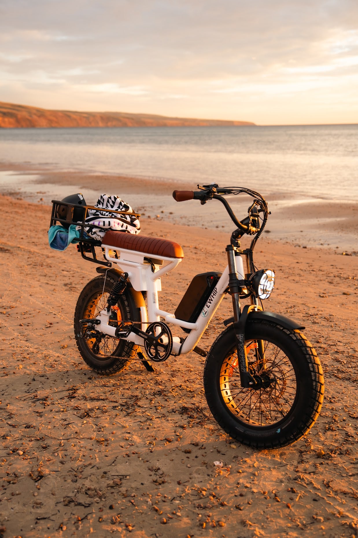 The Captain white street-legal electric fat tyre cruiser side profile at sunset