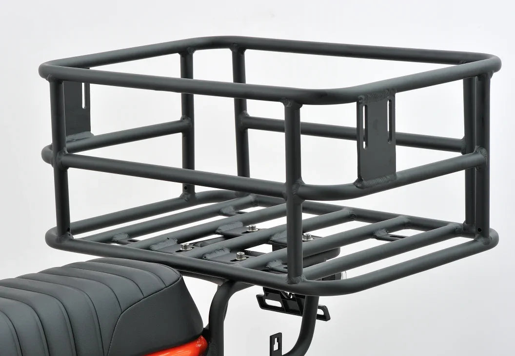 Sturdy black rear cargo rack for e-bike, mounted above seat, ideal for carrying gear on street-legal rides.
